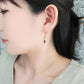 18K / 10K Rose Gold Garnet Crescent Earrings - Model Image