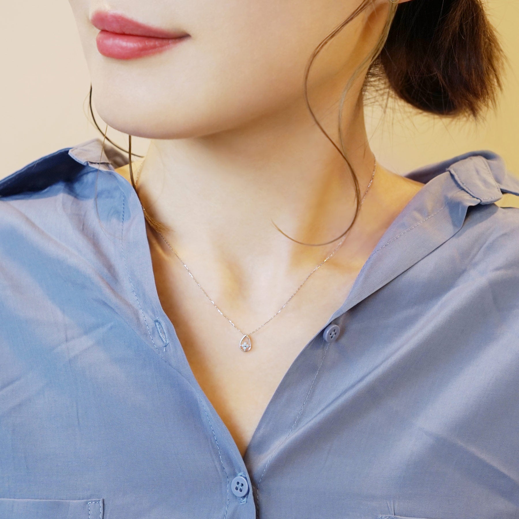 10K White Gold Ice Blue Diamond Dew Drop Clover Necklace - Model Image