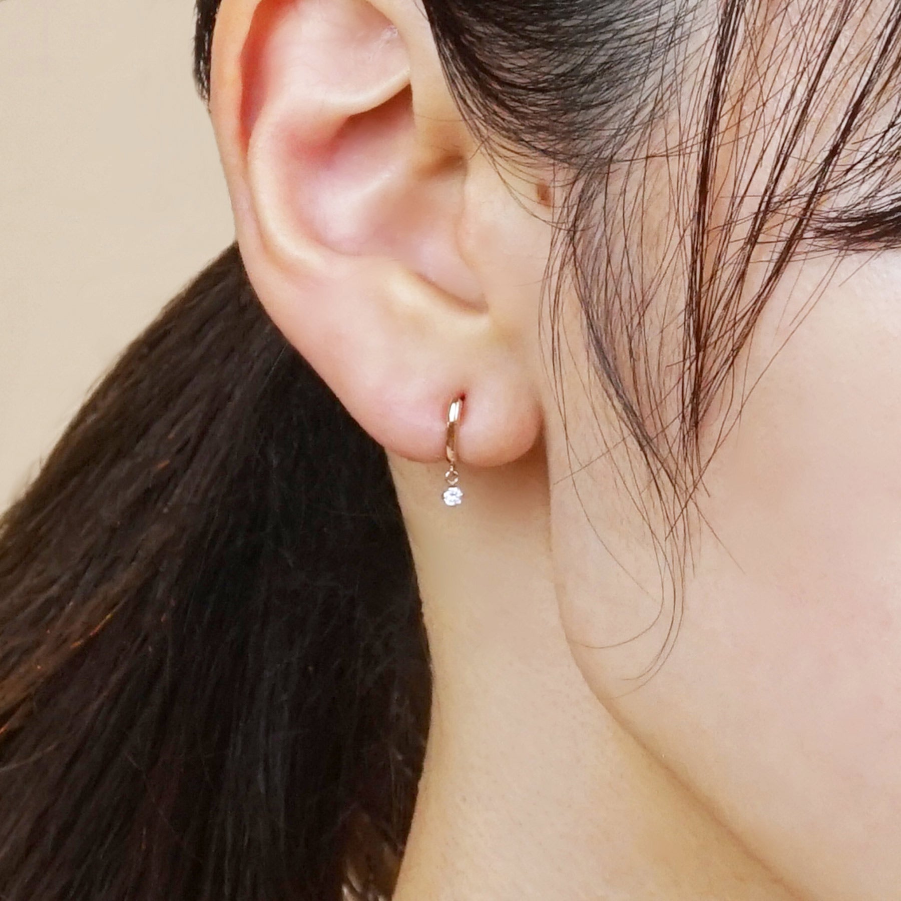 18K/10K Rose Gold Swaying Cubic Zirconia Hoop Earrings - Model Image