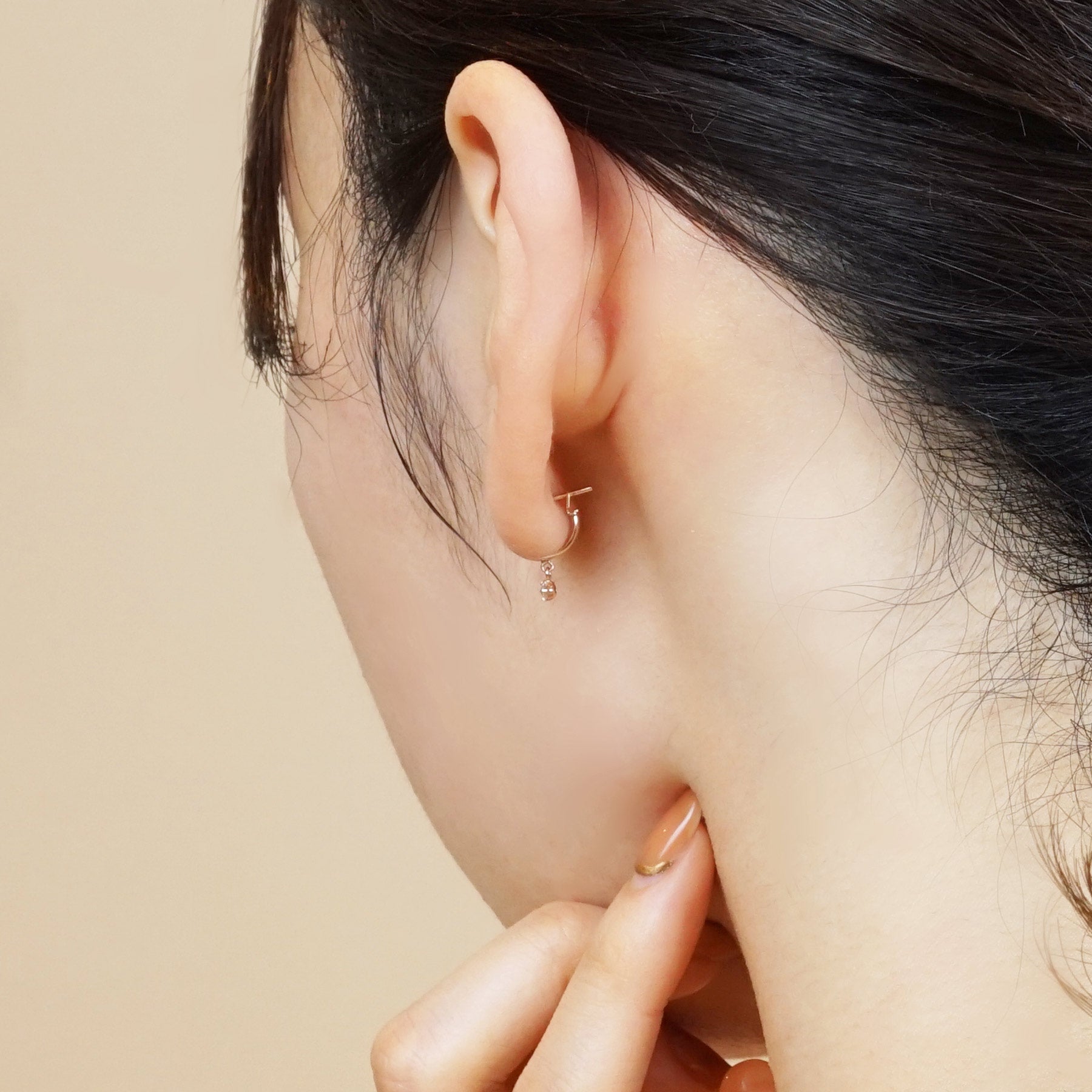 18K/10K Rose Gold Swaying Cubic Zirconia Hoop Earrings - Model Image