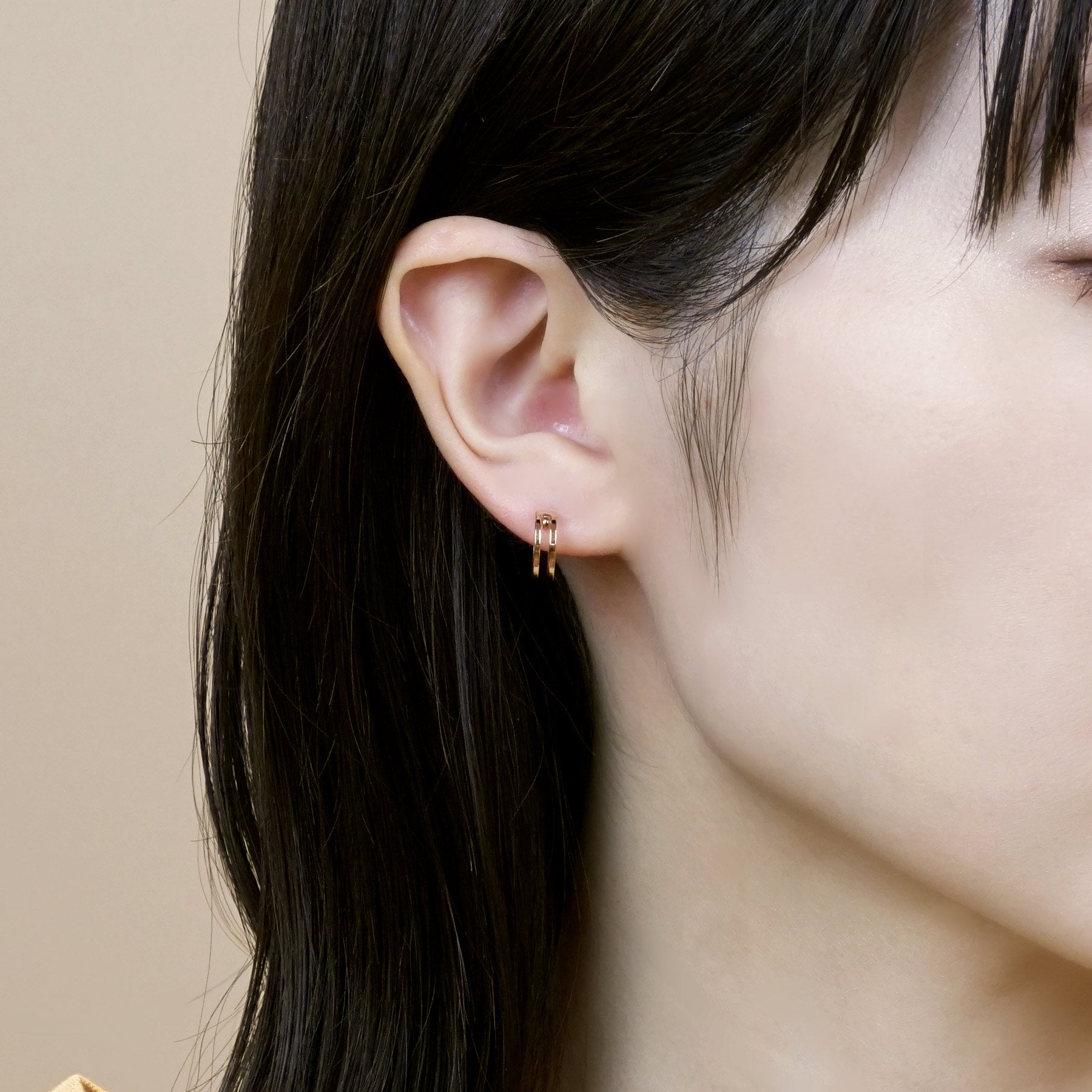 18K/10K Rose Gold Mini Hoop Earrings - Model Image