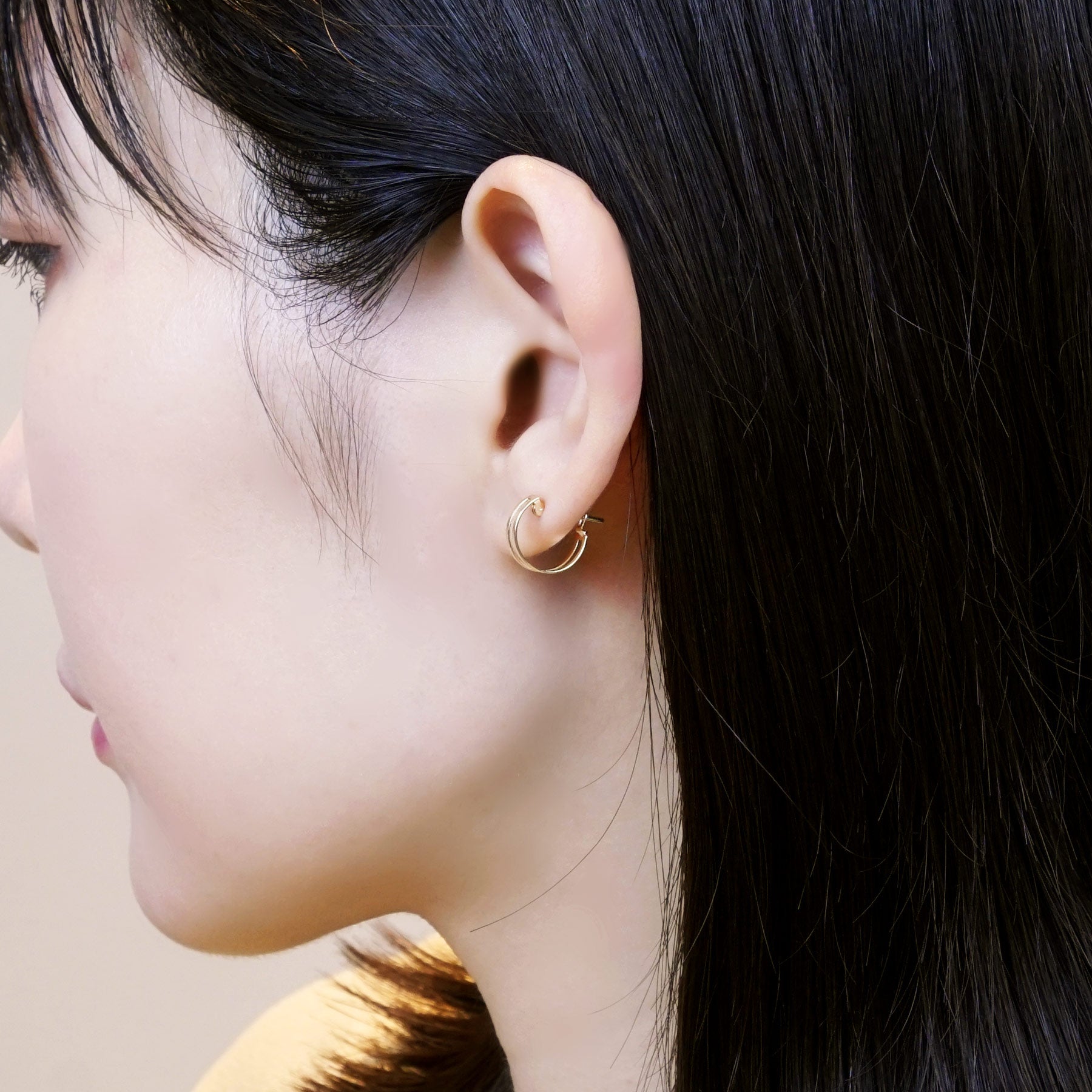 18K/10K Yellow Gold Mini Hoop Earrings - Model Image