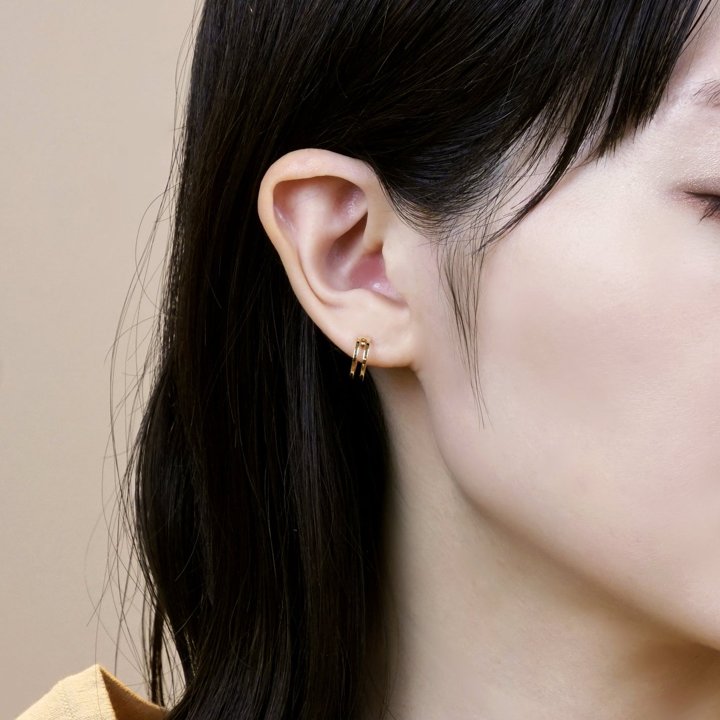 18K/10K Yellow Gold Mini Hoop Earrings - Model Image