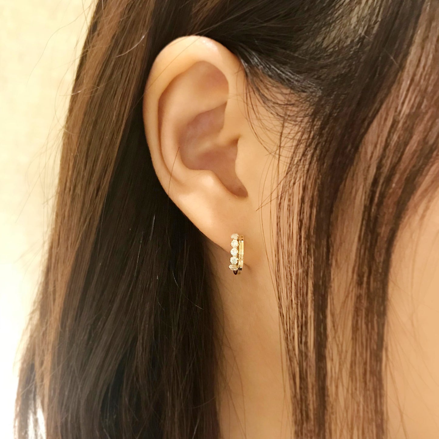 14K/10K Yellow Gold Cubic Zirconia Hoop Earrings - Model Image